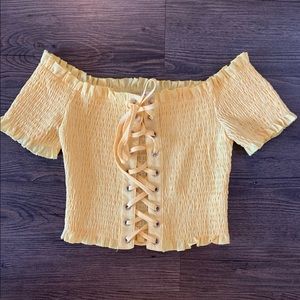 Cute yellow crop top with lace touch!